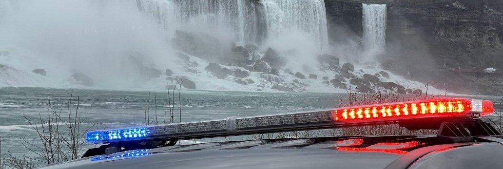 Police Cruiser Lights in Front of Niagara Falls