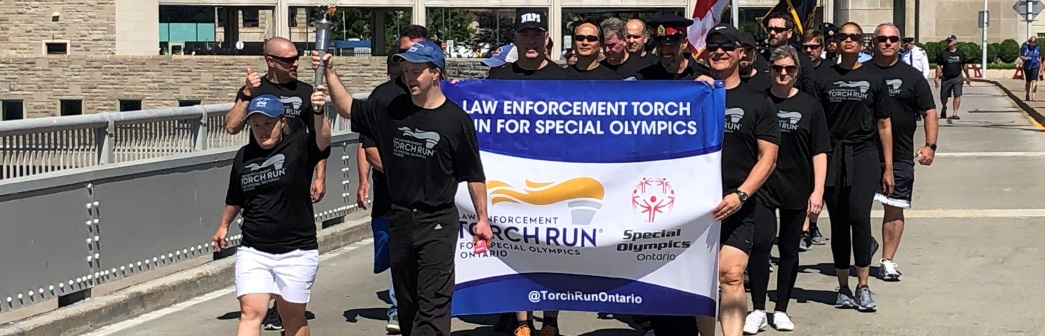 officers participating in special Olympics torch run