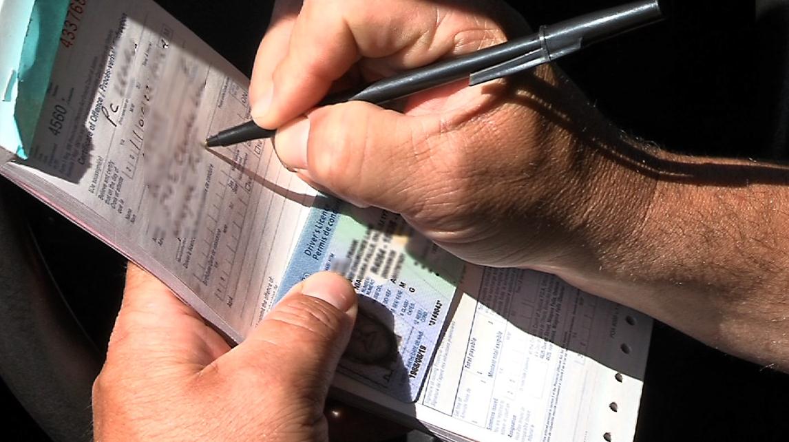 Officer writing a ticket