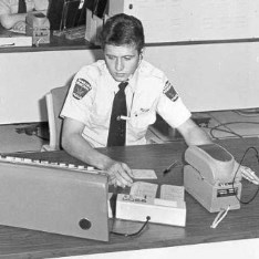 Cst. Storm answers calls in the Communications Unit