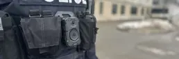 a close up of an officer wearing a body worn camera