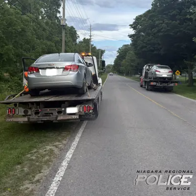 Photo of two separate vehicles being seized in RIDE initiative 