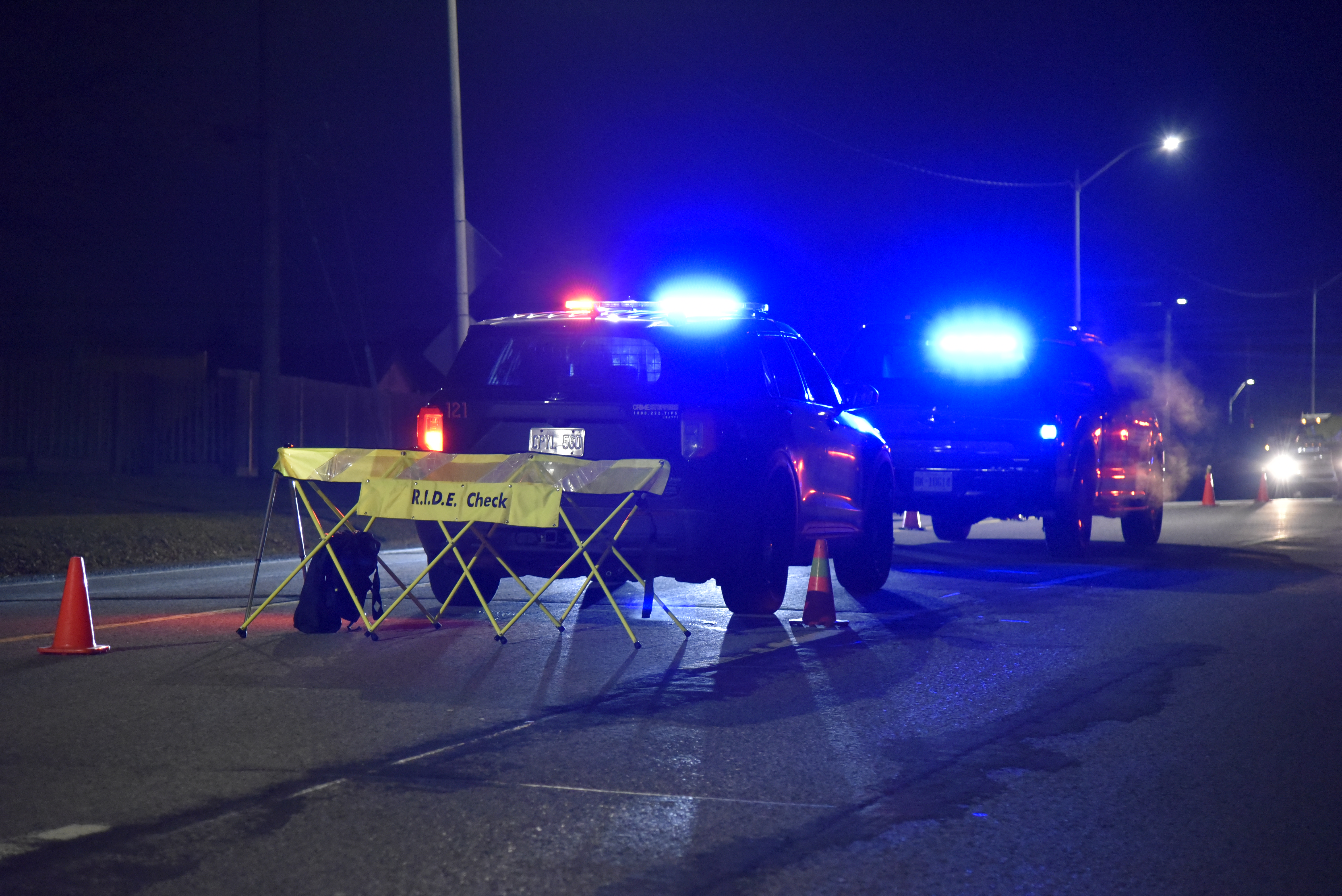 Cruiser at night with a ride check sign