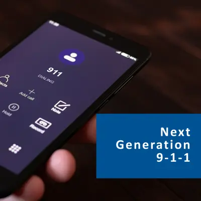 Next Generation 9-1-1 button with a close up image of a cell phone in someone's hand