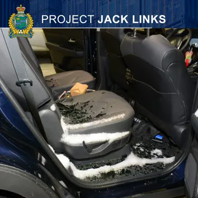 The back seat of a vehicle with broken window on it