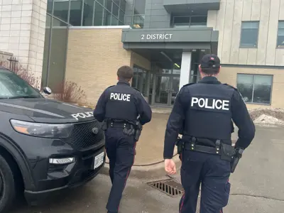 close up of officers walking toward a building