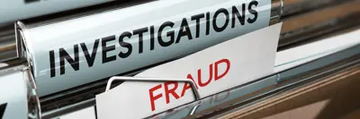 a hanging file folder that has a red tag that reads "fraud"