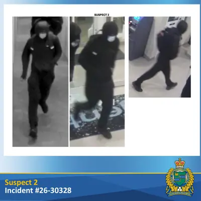 suspect wearing black clothing and black pants
