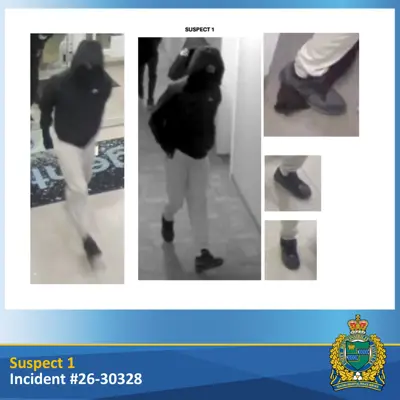 Suspect wearing black clothing and white pants